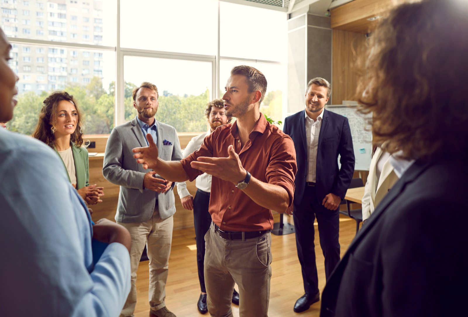 A leader speaking to a room of colleagues